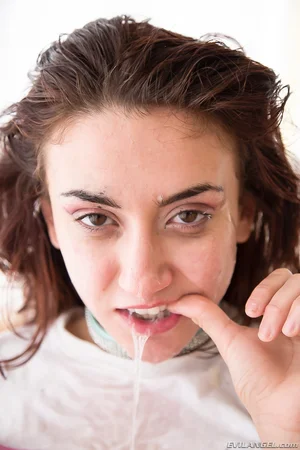Pierced Mandy Muse in ponytails munching jizz while toying taut butt with fake penis - 15
